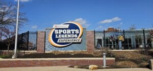 Sign for The Sports Legends Experience by Riley Children's Health, north of the entrance at The Children's Museum